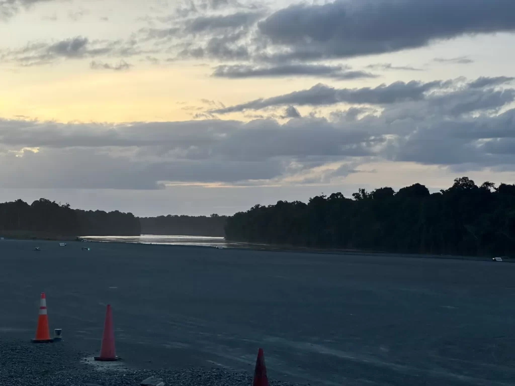 Gravel runway at dusk with no runway lighting, before the solar airfield lighting upgrade